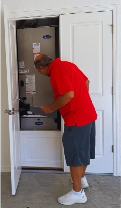 Mark from In the Bubble Home Watch checking the home’s air conditioning unit during a scheduled inspection visit in The Villages, Florida.