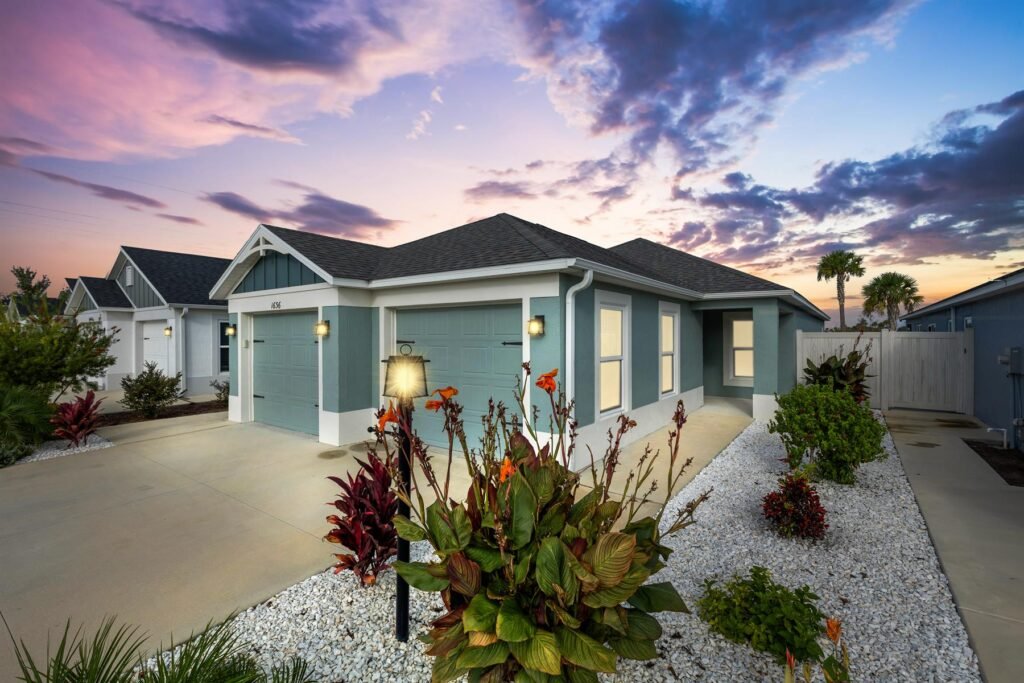Florida home with palm trees and inviting front porch representing home watch services that keep properties secure while homeowners are away.